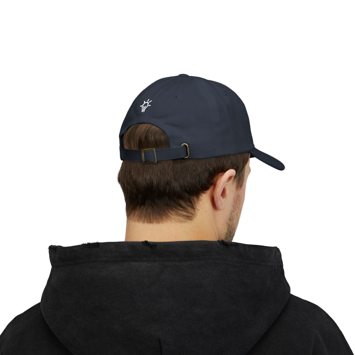 Bright Acres navy dad cap worn by an adult, showing rear lightbulb embroidery and adjustable strap