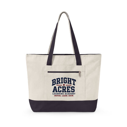 Bright Acres canvas tote in Natural/Navy, collegiate design on front zip pocket