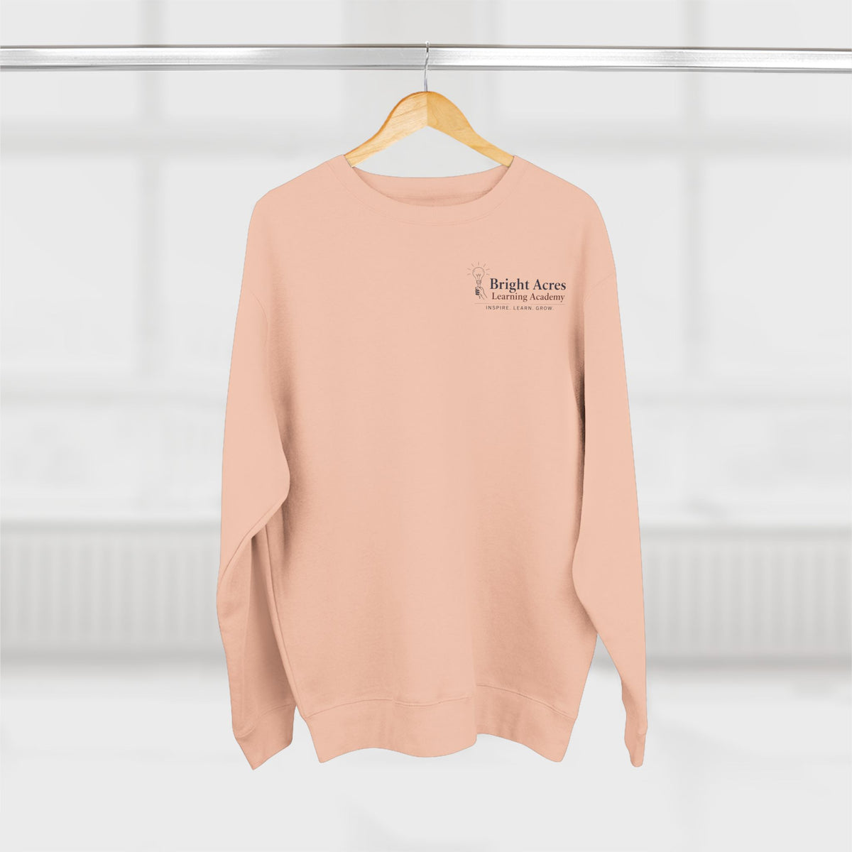 Bright Acres Bright Minds Together Fleece Adult Crewneck — Pale Pink, front hanging