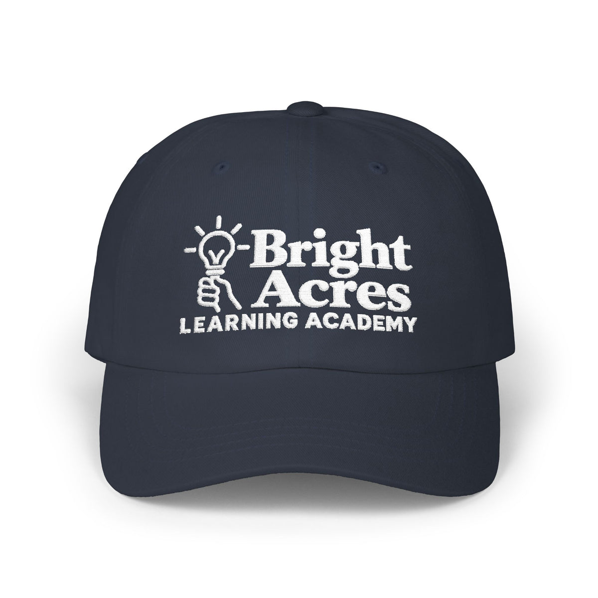 Bright Acres navy dad cap with white embroidered school logo, front